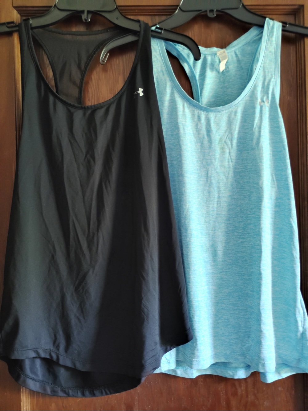 2 Under Armour Women’s Black and Light Blue Racerback Tank Tops